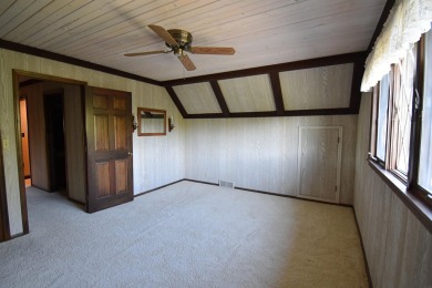 Chalet-style charm meets scenic beauty in this 3-bedroom, 2-bath on River Ridge Golf Club in Iowa - for sale on GolfHomes.com, golf home, golf lot