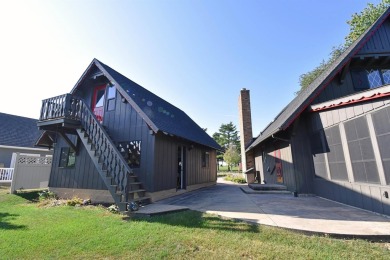 Chalet-style charm meets scenic beauty in this 3-bedroom, 2-bath on River Ridge Golf Club in Iowa - for sale on GolfHomes.com, golf home, golf lot