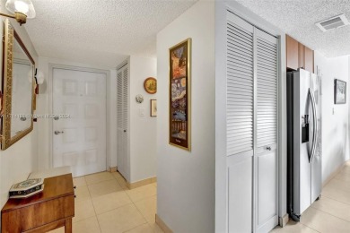 Beautiful 3/2 condo with serene lake and golf course views in on Pine Island Ridge Country Club in Florida - for sale on GolfHomes.com, golf home, golf lot