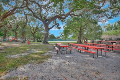 Beautiful 3/2 condo with serene lake and golf course views in on Pine Island Ridge Country Club in Florida - for sale on GolfHomes.com, golf home, golf lot