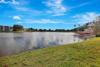 Beautiful 3/2 condo with serene lake and golf course views in on Pine Island Ridge Country Club in Florida - for sale on GolfHomes.com, golf home, golf lot