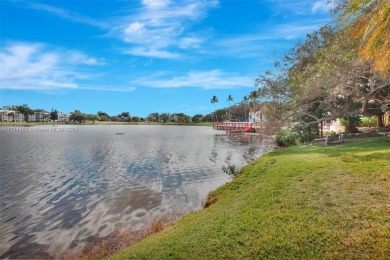 Beautiful 3/2 condo with serene lake and golf course views in on Pine Island Ridge Country Club in Florida - for sale on GolfHomes.com, golf home, golf lot