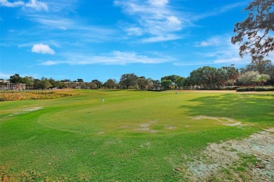 Beautiful 3/2 condo with serene lake and golf course views in on Pine Island Ridge Country Club in Florida - for sale on GolfHomes.com, golf home, golf lot