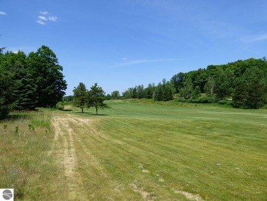 Lovely golf course lot overlooking the 6th fairway of the Summit on Shanty Creek Golf Course in Michigan - for sale on GolfHomes.com, golf home, golf lot