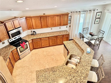 DON'T MISS THIS 4 BEDROMED 3 1/2 BATH ( 2 EN-SUITE ) WITH HEATED on Remington Golf Club in Florida - for sale on GolfHomes.com, golf home, golf lot