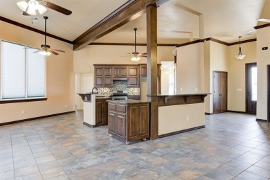 Come see this beautiful 3385 sq ft home on .90 acres overlooking on Cimarron National Golf Club in Oklahoma - for sale on GolfHomes.com, golf home, golf lot