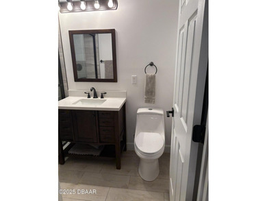 Fantastic beach house with gut renovation in 2022 including new on Oceanside Country Club in Florida - for sale on GolfHomes.com, golf home, golf lot