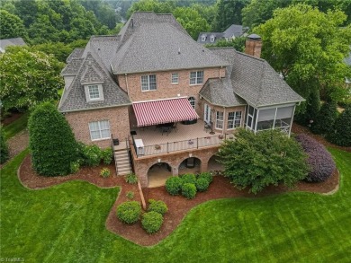 Exquisite offering in Salem Glen, overlooking the 14th Hole on Salem Glen Country Club in North Carolina - for sale on GolfHomes.com, golf home, golf lot