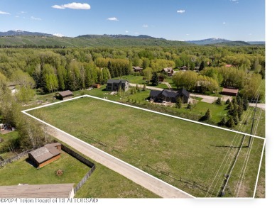 Rare vacant lot opportunity on the westbank of the Snake River on Teton Pines Golf Club in Wyoming - for sale on GolfHomes.com, golf home, golf lot