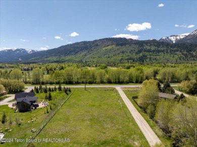 Rare vacant lot opportunity on the westbank of the Snake River on Teton Pines Golf Club in Wyoming - for sale on GolfHomes.com, golf home, golf lot