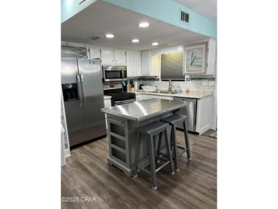 Your Coastal Oasis Awaits at 153 Gulf Highlands Blvd! STOP on Edgewater Beach Resort in Florida - for sale on GolfHomes.com, golf home, golf lot