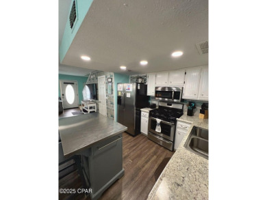 Your Coastal Oasis Awaits at 153 Gulf Highlands Blvd! STOP on Edgewater Beach Resort in Florida - for sale on GolfHomes.com, golf home, golf lot