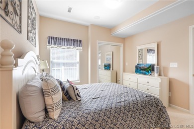 This well-positioned 5th-floor end-unit condo offers expansive on Tan-Tar-A Golf Club in Missouri - for sale on GolfHomes.com, golf home, golf lot