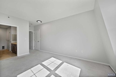 1269sf 2-bedroom, 2-bathroom with a balcony, in unit laundry, 1 on Liberty National in New Jersey - for sale on GolfHomes.com, golf home, golf lot