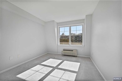 1269sf 2-bedroom, 2-bathroom with a balcony, in unit laundry, 1 on Liberty National in New Jersey - for sale on GolfHomes.com, golf home, golf lot