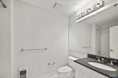 1269sf 2-bedroom, 2-bathroom with a balcony, in unit laundry, 1 on Liberty National in New Jersey - for sale on GolfHomes.com, golf home, golf lot