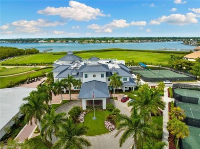 Enjoy breathtaking panoramic views of the serene lake and on Windstar on Naples Bay in Florida - for sale on GolfHomes.com, golf home, golf lot