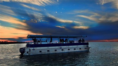 Enjoy breathtaking panoramic views of the serene lake and on Windstar on Naples Bay in Florida - for sale on GolfHomes.com, golf home, golf lot