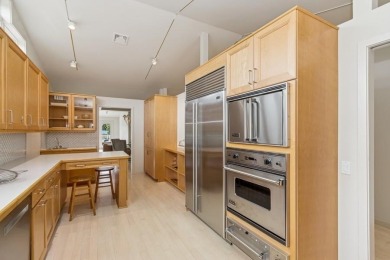 FRESH AND SLEEK CONDOMINIUM combining clean lines with practical on Elks Lodge 590 in Iowa - for sale on GolfHomes.com, golf home, golf lot