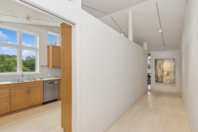 FRESH AND SLEEK CONDOMINIUM combining clean lines with practical on Elks Lodge 590 in Iowa - for sale on GolfHomes.com, golf home, golf lot