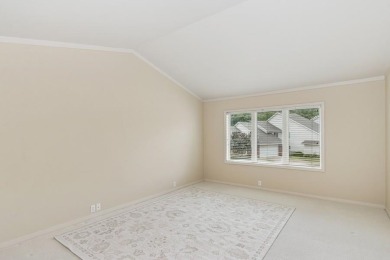 FRESH AND SLEEK CONDOMINIUM combining clean lines with practical on Elks Lodge 590 in Iowa - for sale on GolfHomes.com, golf home, golf lot