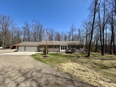 Privacy and seclusion await at this true Up North retreat! This on Forest Dunes Golf Club in Michigan - for sale on GolfHomes.com, golf home, golf lot
