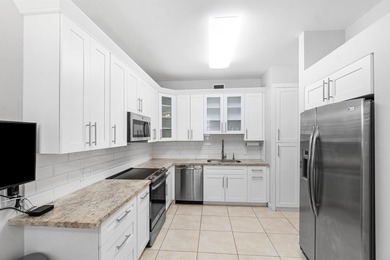 This charming first-floor condo offers comfortable living with on Polo Club of Boca Raton in Florida - for sale on GolfHomes.com, golf home, golf lot