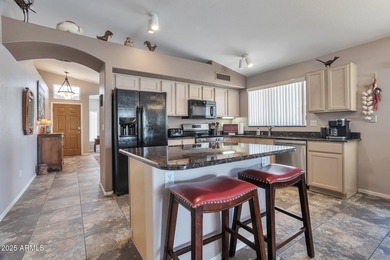 Nestled in a vibrant, active community with scenic golf courses on Coyote Lakes Golf Club in Arizona - for sale on GolfHomes.com, golf home, golf lot