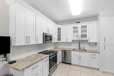 This charming first-floor condo offers comfortable living with on Polo Club of Boca Raton in Florida - for sale on GolfHomes.com, golf home, golf lot