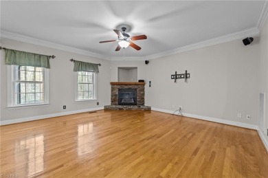 This beautifully designed 4-bedroom, 3.5-bathroom home perfectly on Forest Oaks Country Club in North Carolina - for sale on GolfHomes.com, golf home, golf lot