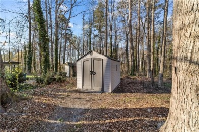 This beautifully designed 4-bedroom, 3.5-bathroom home perfectly on Forest Oaks Country Club in North Carolina - for sale on GolfHomes.com, golf home, golf lot