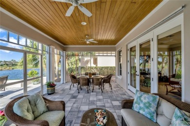 This stunning courtyard pool home with serene lake views has on Orchid Island Golf and Beach Club in Florida - for sale on GolfHomes.com, golf home, golf lot