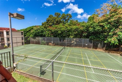 Step into serenity with this inviting 2-bedroom, 1-bathroom on Makaha Valley Country Club in Hawaii - for sale on GolfHomes.com, golf home, golf lot