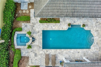 This stunning courtyard pool home with serene lake views has on Orchid Island Golf and Beach Club in Florida - for sale on GolfHomes.com, golf home, golf lot