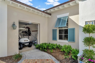 This stunning courtyard pool home with serene lake views has on Orchid Island Golf and Beach Club in Florida - for sale on GolfHomes.com, golf home, golf lot