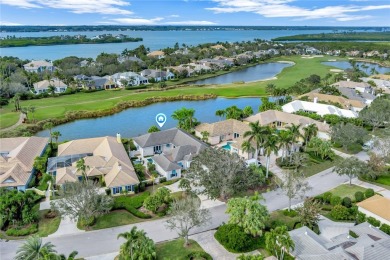 This stunning courtyard pool home with serene lake views has on Orchid Island Golf and Beach Club in Florida - for sale on GolfHomes.com, golf home, golf lot