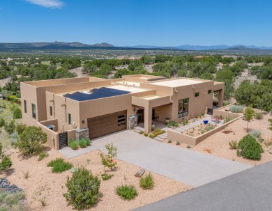 Discover the perfect blend of modern luxury and Southwest charm on The Club At Las Campanas  in New Mexico - for sale on GolfHomes.com, golf home, golf lot