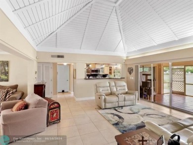 Natural light welcomes you as it fills the large, open living on Woodlands Country Club in Florida - for sale on GolfHomes.com, golf home, golf lot