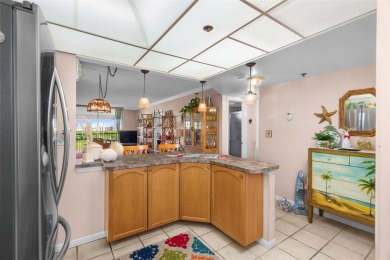 Welcome to elevated living ~ literally. This 2-bedroom on Grande Oaks Golf Club in Florida - for sale on GolfHomes.com, golf home, golf lot