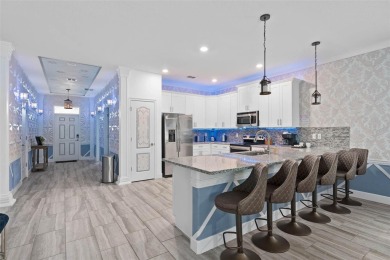 Welcome to the Fire  Ice Castle, a beautifully remodeled on The Oasis Club at Champions Gate in Florida - for sale on GolfHomes.com, golf home, golf lot