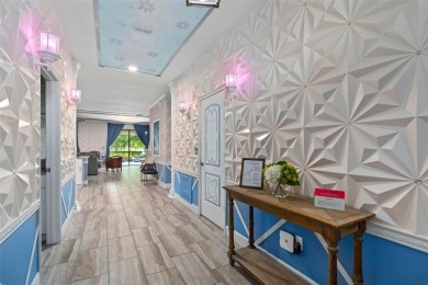 Welcome to the Fire  Ice Castle, a beautifully remodeled on The Oasis Club at Champions Gate in Florida - for sale on GolfHomes.com, golf home, golf lot
