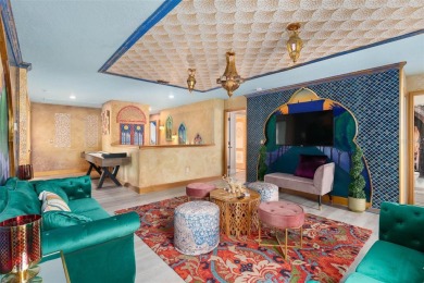 Welcome to the Fire  Ice Castle, a beautifully remodeled on The Oasis Club at Champions Gate in Florida - for sale on GolfHomes.com, golf home, golf lot