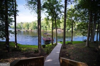 Dive into lakeside luxury at its finest in the heart of Turtle on Turtle Cove Golf Course in Georgia - for sale on GolfHomes.com, golf home, golf lot