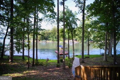 Dive into lakeside luxury at its finest in the heart of Turtle on Turtle Cove Golf Course in Georgia - for sale on GolfHomes.com, golf home, golf lot