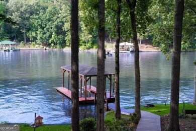 Dive into lakeside luxury at its finest in the heart of Turtle on Turtle Cove Golf Course in Georgia - for sale on GolfHomes.com, golf home, golf lot