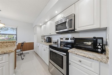 MAJOR PRICE IMPROVEMENT! WILL NOT LAST ...Beautifully maintained on Woodmont Country Club in Florida - for sale on GolfHomes.com, golf home, golf lot