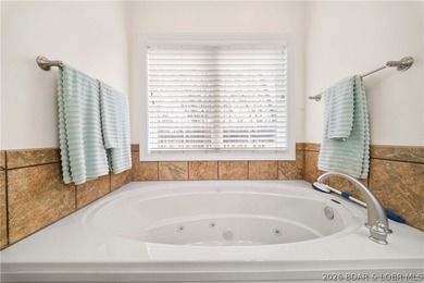 Step inside this stunning, updated villa perfectly positioned on on The Club At Porto Cima in Missouri - for sale on GolfHomes.com, golf home, golf lot