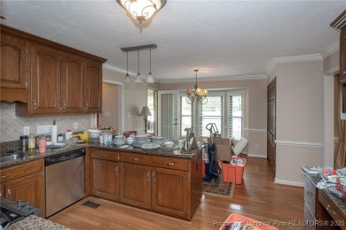 Located in the desirable Kings Grant golf community with no HOA on Kings Grant Golf and Country Club in North Carolina - for sale on GolfHomes.com, golf home, golf lot
