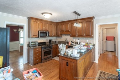 Located in the desirable Kings Grant golf community with no HOA on Kings Grant Golf and Country Club in North Carolina - for sale on GolfHomes.com, golf home, golf lot