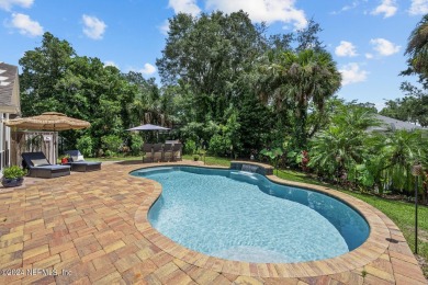 Discover your dream home in the exclusive Queens Harbour Yacht & on Queens Harbour Yacht and Country Club in Florida - for sale on GolfHomes.com, golf home, golf lot